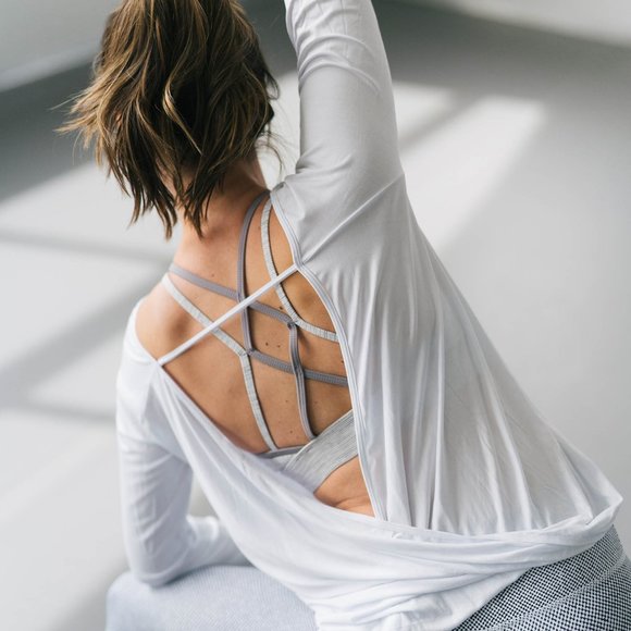 ZYIA Tops - COPIED: Oh so cute ZYIA NAMASTE WHITE T.